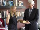 Dava Newman KB1HIK, is sworn in at her MIT office, with her partner Gui Trotti assisting. [Courtesy of MIT]